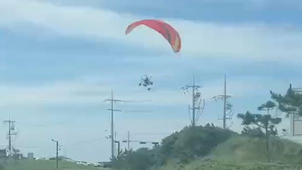 A video purportedly showed a Hamas militant in a paraglider flying into a high-voltage electric power line.